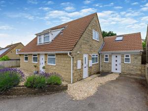 a brick house with a brown roof at 5 Bed in Charmouth 83584 in Charmouth