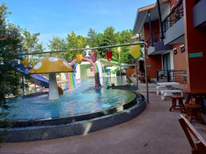 a pool with a water park with a water slide at The Rabbit Home in Nakhon Nayok