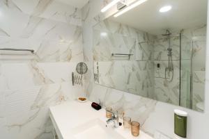 a white bathroom with a sink and a shower at Lumen Gasztropanzió in Eger +54 photos