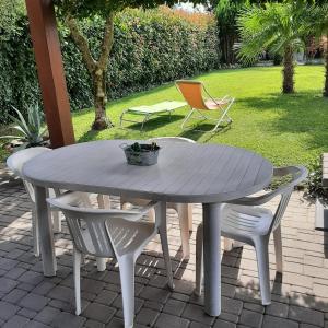 a gray table and chairs on a patio at Casa Luce e Aria in Colico