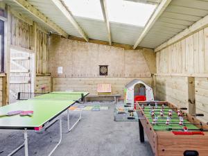 a ping pong room with ping pong tables in it at 3 Bed in Bude BBARN in Sutcombe