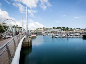 a bridge over a river with boats in a marina at 1 Bed in Torquay 36488 in Torquay