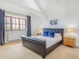 a bedroom with a large bed and a window at 3 Bed in Praa Sands 36258 in Germoe