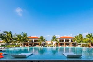 a large swimming pool in front of a resort at Blue Sky & Villas Beach Resort in Da Nang