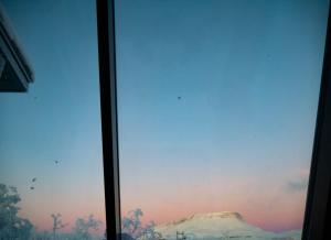 a view of a mountain from a window at Aurora View Lapland, Sky View Bedroom in Kilpisjärvi +43 photos