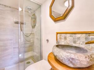 a bathroom with a stone sink and a shower at 2 Bed in Rothbury 88270 in Rothbury