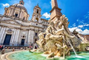 a fountain in front of a building at Small & cozy near Piazza Navona in Rome