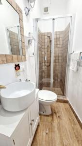 a bathroom with a toilet and a sink and a shower at Small & cozy near Piazza Navona in Rome
