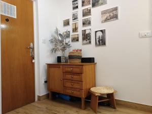 a hallway with a dresser and pictures on the wall at Apartment Lea in Dubrovnik