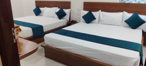 A bed or beds in a room at Mayura residency