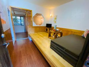 TV a/nebo společenská místnost v ubytování Shan Shui-Yuan Vege Guest House