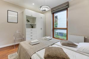 Posteľ alebo postele v izbe v ubytovaní Nadmorski Park Comfort Apartments