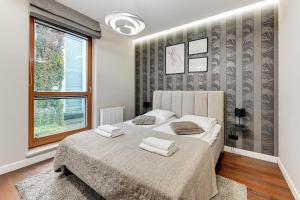 Posteľ alebo postele v izbe v ubytovaní Nadmorski Park Comfort Apartments