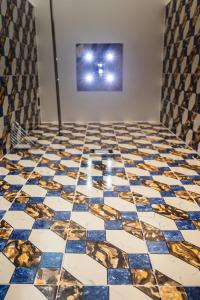 a room with a blue and gold tiled floor at Hotel Marina Riviera in Amalfi