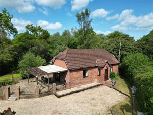 an image of a house with a roof at Paultons Golf Lodge in Ower