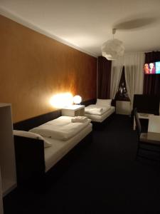 Postel nebo postele na pokoji v ubytování Hotel Bílá Paní