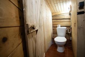 a bathroom with a toilet in a wooden cabin at Chalupa Morávka 1 v Beskydech in Morávka
