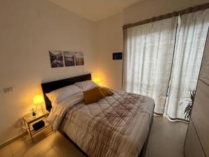 Ένα ή περισσότερα κρεβάτια σε δωμάτιο στο The Base - Comfort a Milano