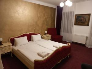 Postel nebo postele na pokoji v ubytování Hotel Bílá Paní
