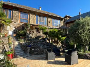 a brick house with a stone staircase in front of it at Le Domaine des Anges 