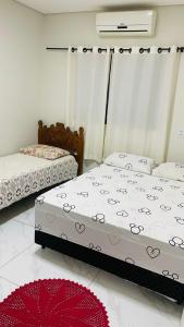 Ένα ή περισσότερα κρεβάτια σε δωμάτιο στο Casa com piscina