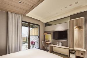 Postel nebo postele na pokoji v ubytování Orange Hotel -Hanzhong, Taipei + 30 fotografií