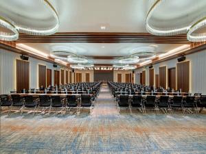 an empty lecture hall with chairs and tables at Park Inn by Radisson Shaoxing China Keqiao in Shaoxing
