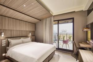 Katil atau katil-katil dalam bilik di Orange Hotel -Hanzhong, Taipei