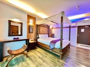 Postel nebo postele na pokoji v ubytování Seasons Bali Fashion Inn