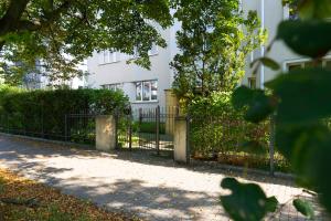 a wrought iron fence in front of a building at Elite Apartments Cozy Studio Sopot in Sopot