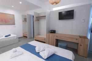 Un pat sau paturi într-o cameră la Il Cortile Isola Casa Vacanze