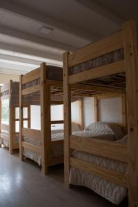 a couple of bunk beds in a room at Casa Amonite Hostel Boutique in Puerto Madryn