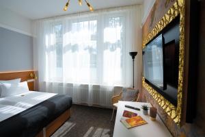 Postel nebo postele na pokoji v ubytování Hotel Kleiner Riesen