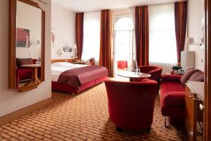 Postel nebo postele na pokoji v ubytování Hotel Schöneberg