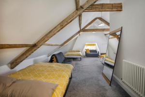 a room with two beds in a attic at Prospect House in York