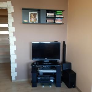 a living room with a flat screen tv on a stand at ClickTheFlat24 Prestige Apart Rooms Pokoje Czechów in Lublin