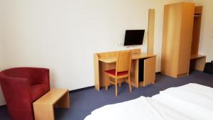 TV a/nebo společenská místnost v ubytování G&K Hotel