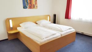 Postel nebo postele na pokoji v ubytování G&K Hotel