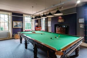 a billiard room with a pool table at The Great House, Orford in Woodbridge