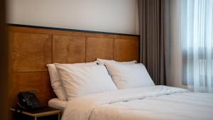 Postel nebo postele na pokoji v ubytování Hotel 701 Gyeongju