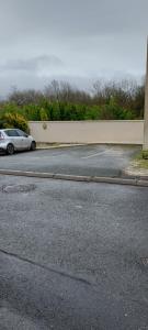 a car parked on the side of a street at Maisonnette in Saintes