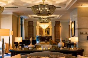 a lobby of a hotel with a chandelier at Four Seasons Hotel Tunis in Gammarth