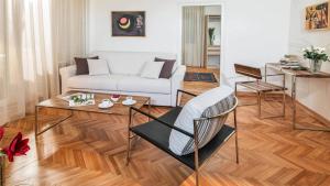 a living room with a couch and a table at Apartment Balkan in Belgrade