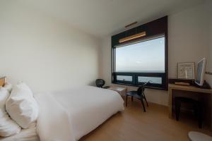 Postel nebo postele na pokoji v ubytování Hotel 701 Gyeongju