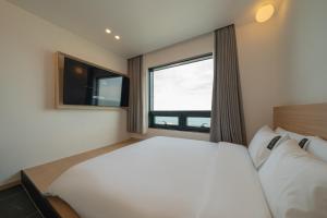 Postel nebo postele na pokoji v ubytování Hotel 701 Gyeongju