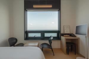 TV a/nebo společenská místnost v ubytování Hotel 701 Gyeongju