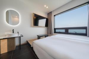 TV a/nebo společenská místnost v ubytování Hotel 701 Gyeongju