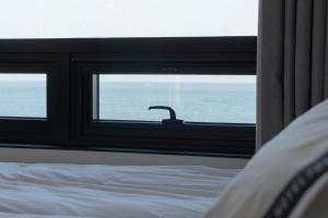 Postel nebo postele na pokoji v ubytování Hotel 701 Gyeongju