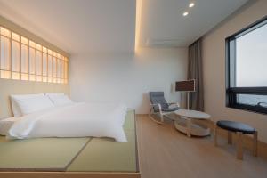 Postel nebo postele na pokoji v ubytování Hotel 701 Gyeongju