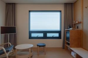 TV a/nebo společenská místnost v ubytování Hotel 701 Gyeongju
